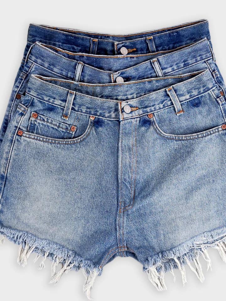 High-Rise Upcycled Denim Cutoff Shorts - Original and other Purchase Wholesale kut from the cloth. Free Returns & Net 60 Terms on Faire trending on Faire.
