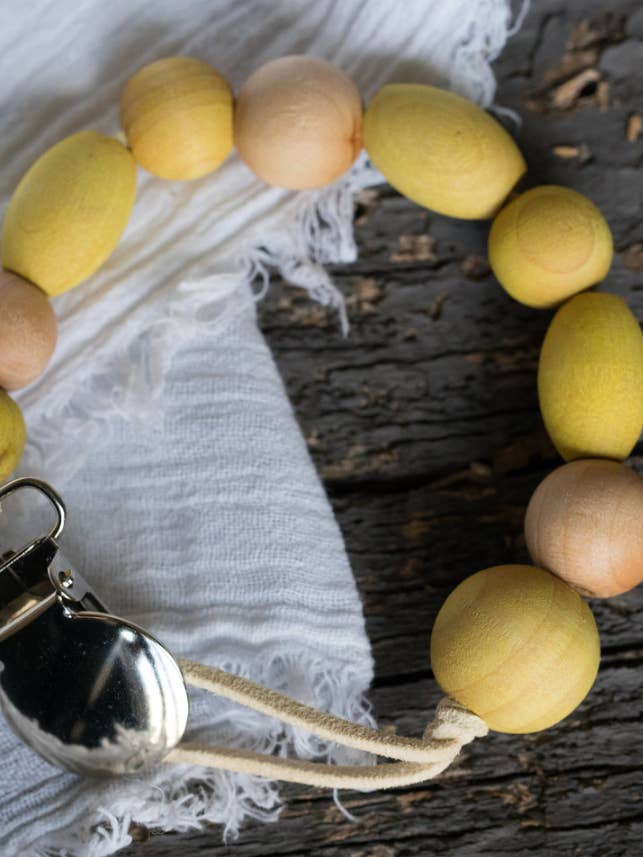 Plant-based wood bead pacifier clip with SS metal attachment for wholesale by Brombie