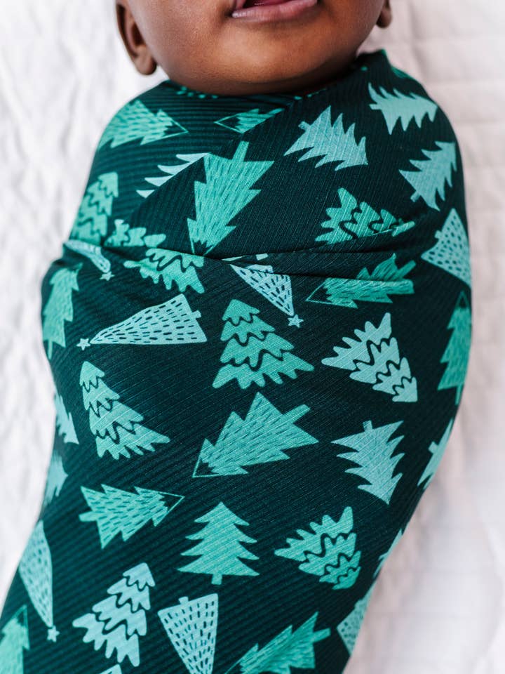 Green Pine Tree Swaddle for wholesale by Little Pajama Co.
