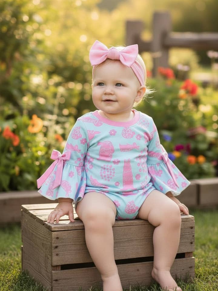 Pink easter bunny printed on blue bodysuit with snaps. RPG60191 SOL for wholesale by Kids Charm Online