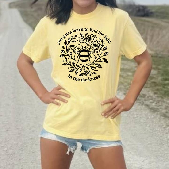 You Gotta Learn to Find the Light in the Darkness Yellow Tee for wholesale by The Red Rival Wholesale