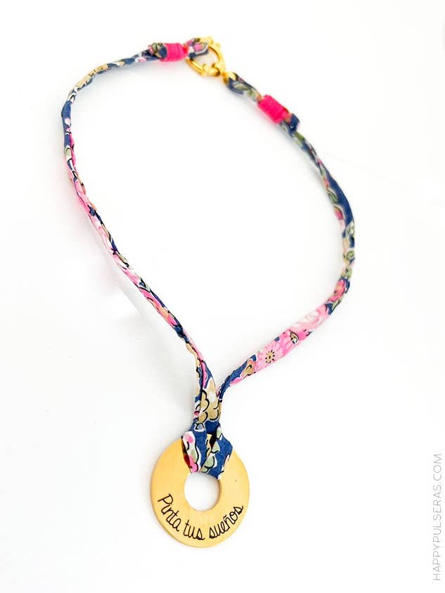 Gold donut pendant in Liberty fabric with blackberry flowers. for wholesale by Happypulseras