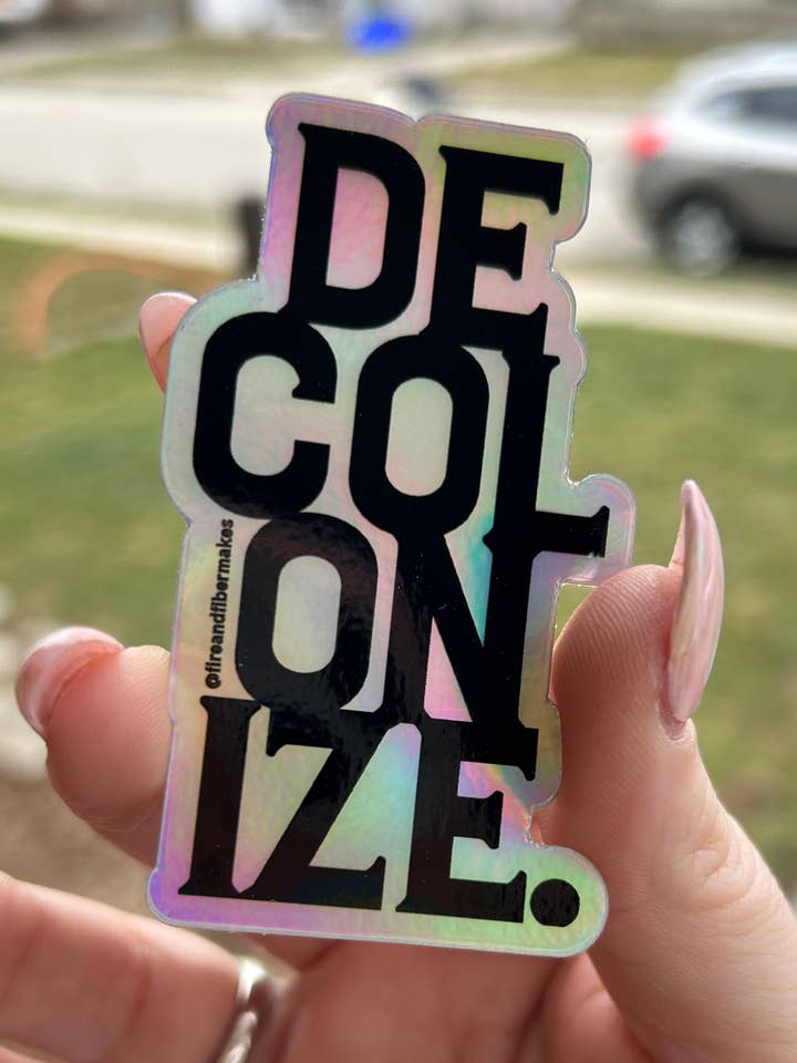 Decolonize Holographic Sticker for wholesale by Fire and Fiber