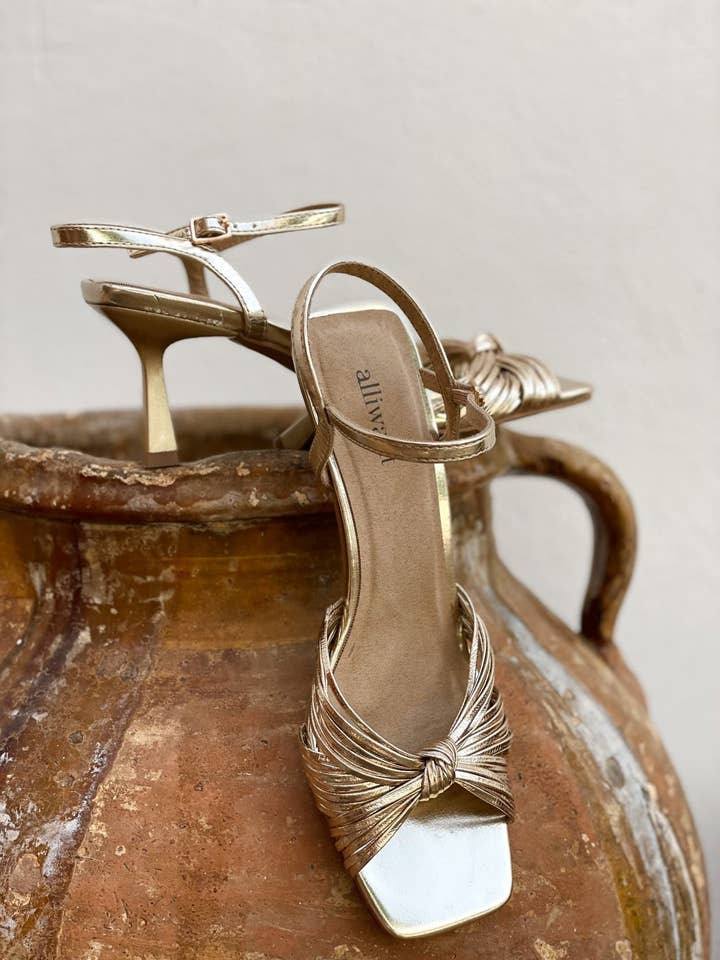 GOLDEN Gold knot heel sandal for wholesale on Faire