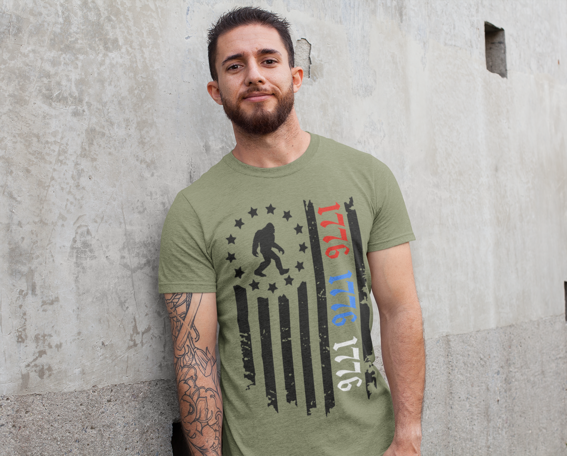 Squatchin’ Country - Wholesale T-Shirt (Graphic) - Unisex - Patriotic 1776 Bigfoot flag shirt - heather military green5
