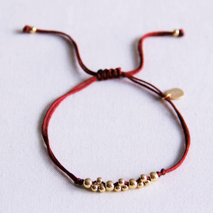 Satin bracelet with gold-colored beads - burgundy for wholesale by Bazou