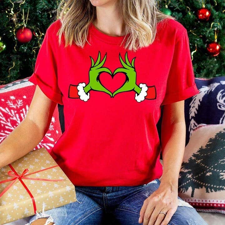 SONDO DESIGN LTD – wholesale T-shirt (graphic) – women's – Christmas Grinch Shirt, Dr. Seuss Grinch Hands Heart Shirt