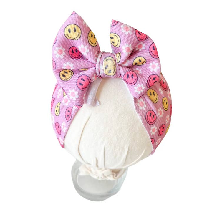 Sourires sur nœud de foulard rose pour la vente par Tiny toes Baby Co
