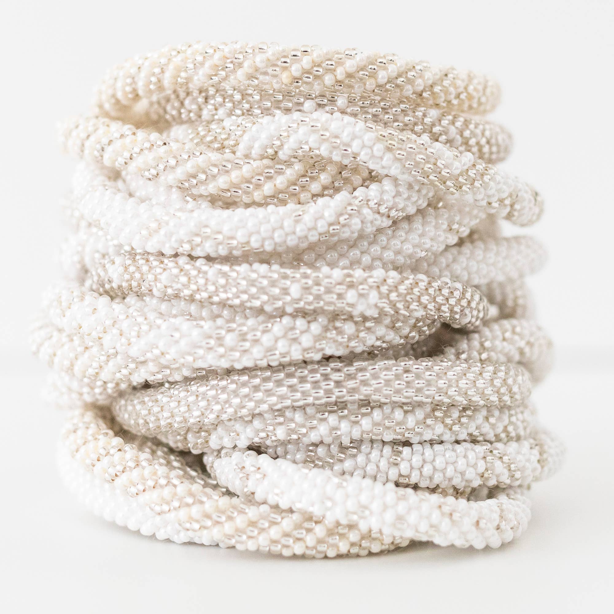 Aid Through Trade - Wholesale Jewelry Set - Roll-On® Bracelets Pearl - Set of 124