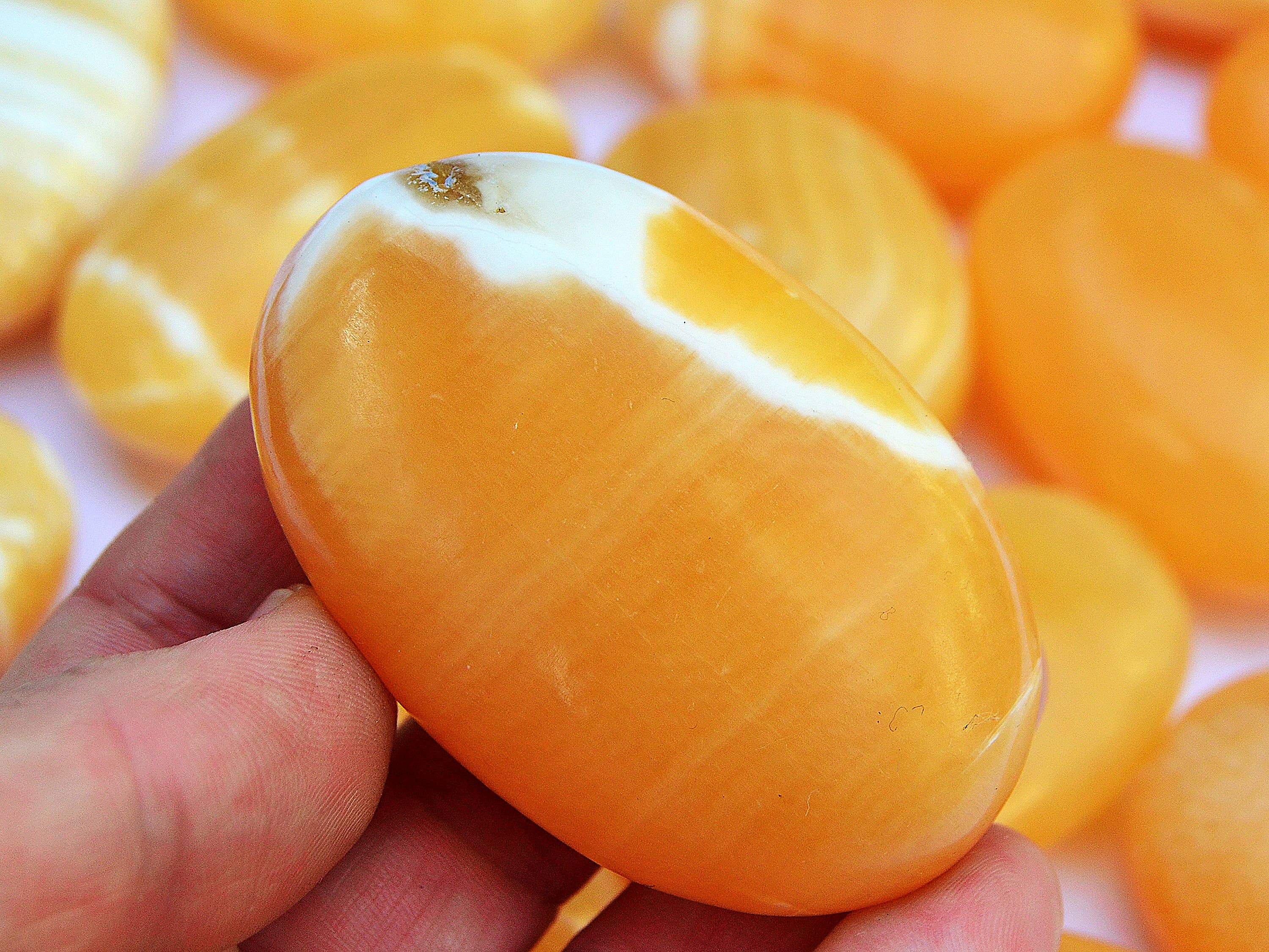 Kaia & Crystals - Wholesale Spiritual Stone/Crystal - Orange Calcite Palm Stone 1 Kg (8-10 Pcs) - (50mm - 70mm)2