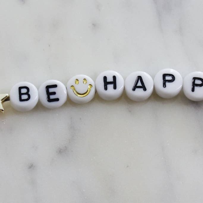 Be Happy Keychain for wholesale by White Daisy Jewelry LLC