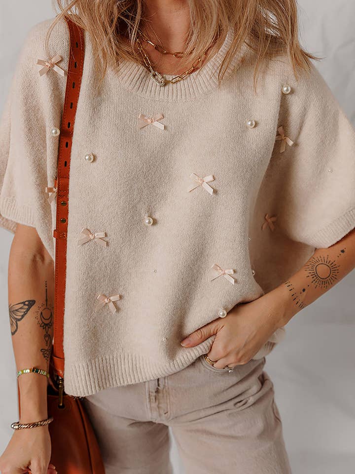 Pyntet sweater med sløjfe og perledetaljer for engroshandel hos Mccolin