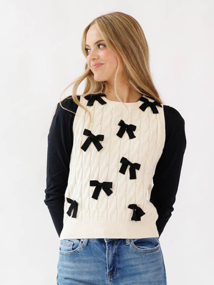 Off-White Sleeveless Sweater Vest with Bow Details for wholesale by Downeast