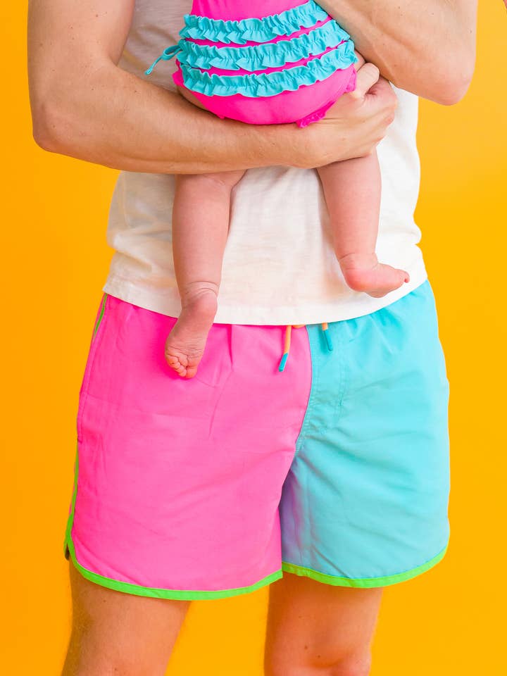 Bañador de hombre con bloques de color neón y dobladillo de delfín para venta al por mayor de RuffleButts + RuggedButts