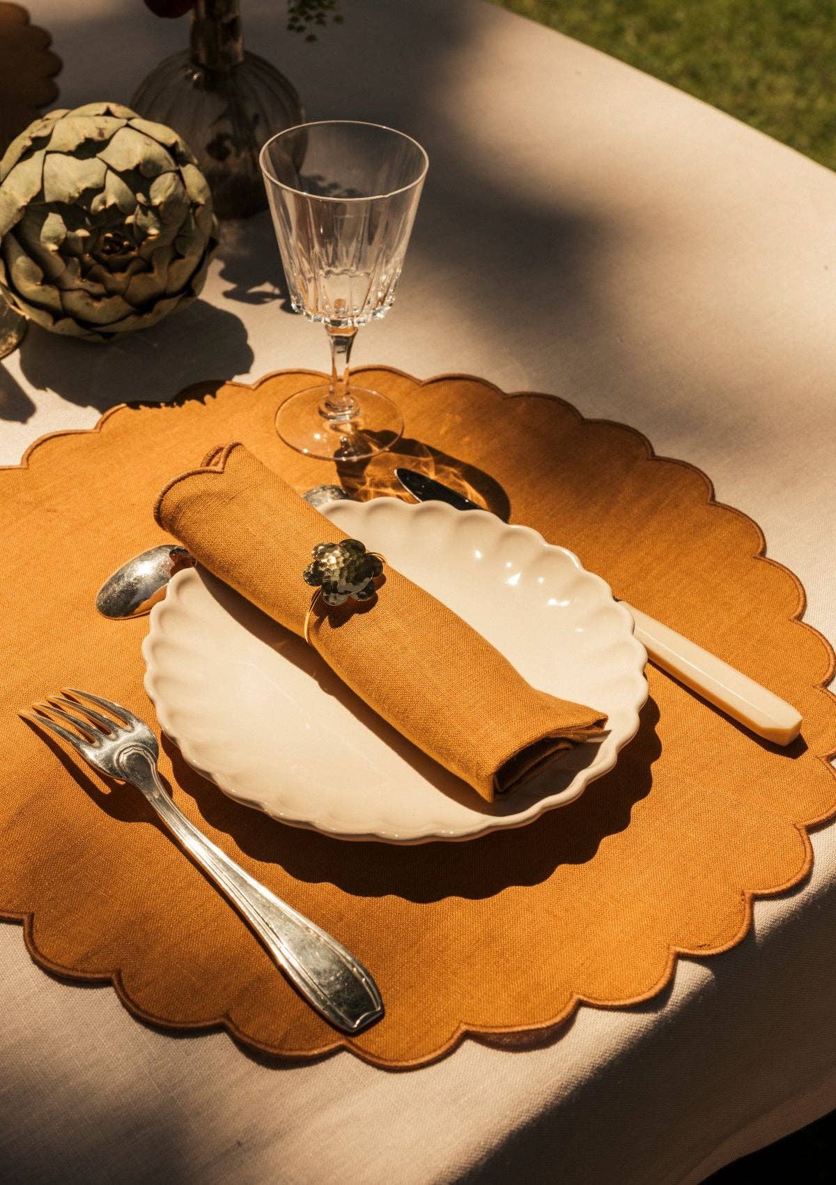 Scalloped round placemats in Ocher yellow linen (set of 2) for wholesale on Faire1