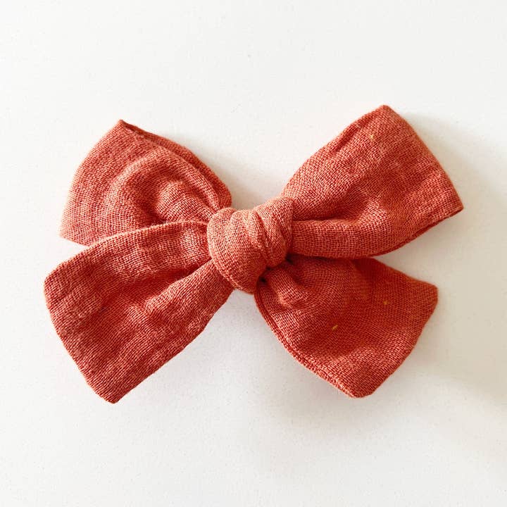 Coral Muslin Bow with Clip | Baby & Toddler Hair Bow for wholesale by Bohemian Babies