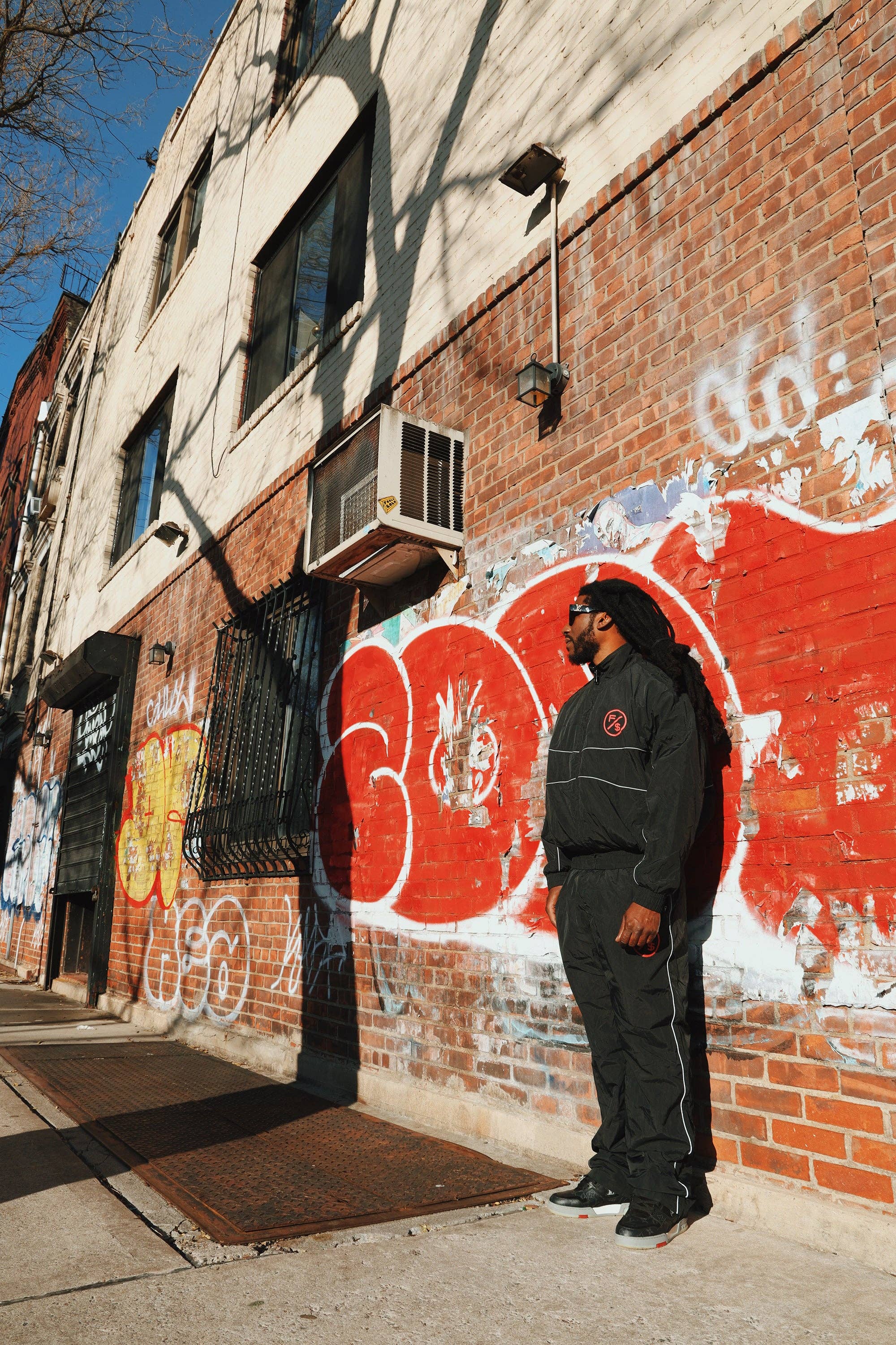 Black Red MOTION Nylon Pants (BRED) for wholesale on Faire7