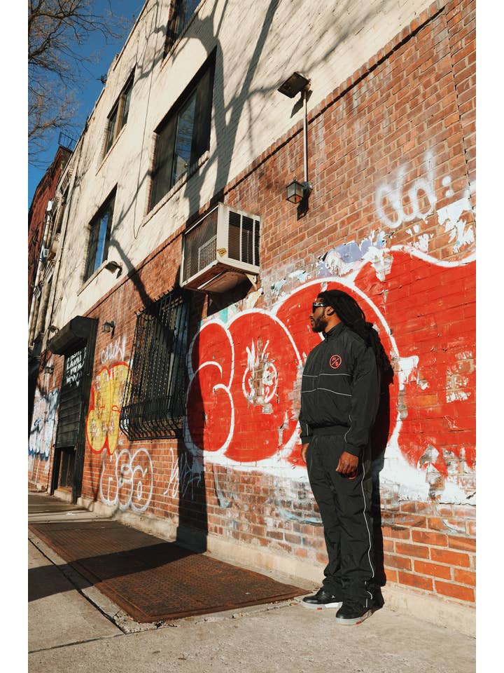 Black Red MOTION Nylon Pants (BRED) for wholesale on Faire7