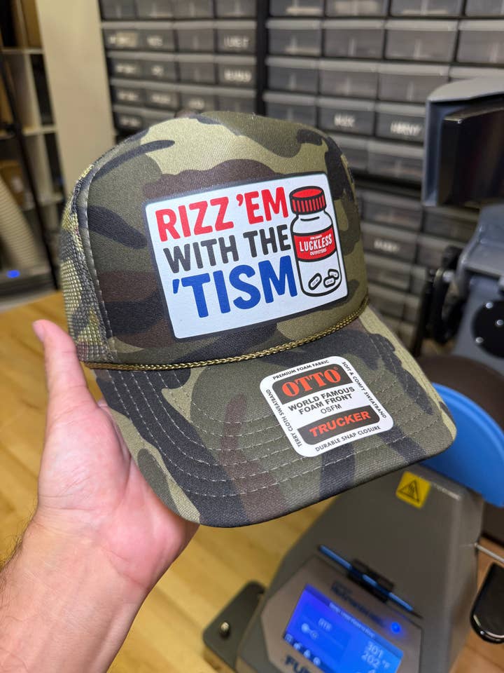 Rizz 'Em With The 'Tism for wholesale by Luckless Outfitters
