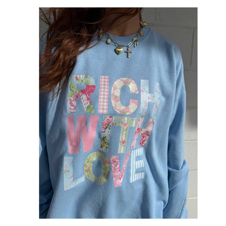 Baby blue floral crewneck sweatshirt for wholesale by Charlie and Claire's