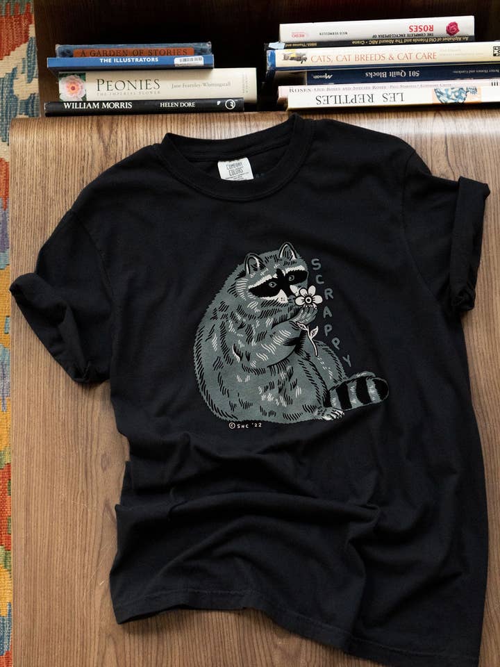 Black Scrappy Raccoon T-Shirt for wholesale on Faire