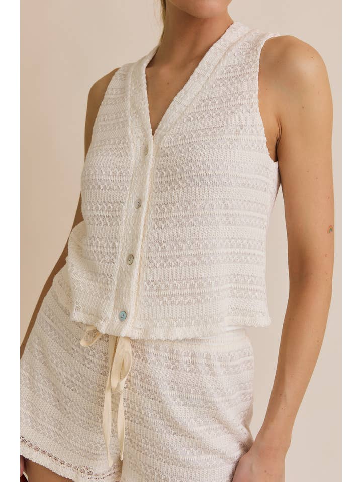 CREAM BUTTON UP SLEEVELESS CROCHET TOP AND WAIST TIE CROCHET SHORT for wholesale on Faire