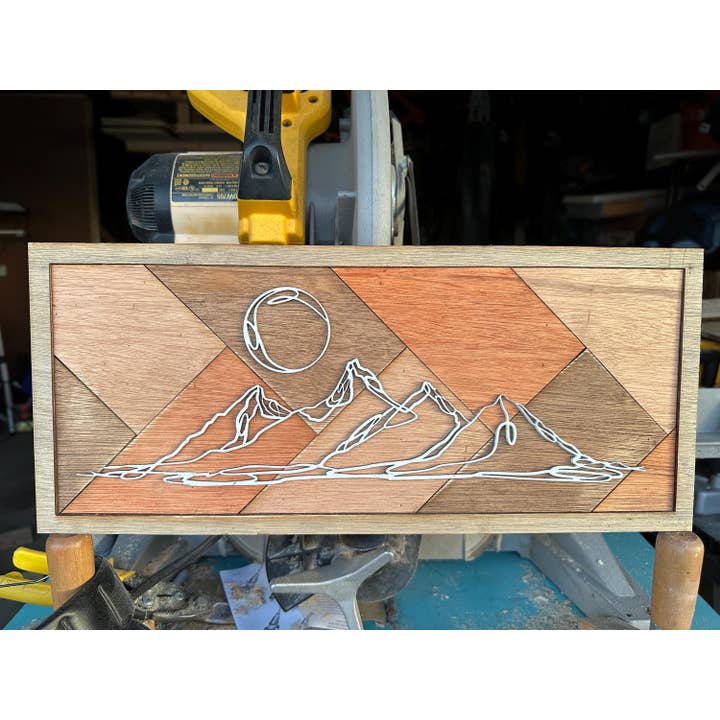 Handcrafted Wooden Mountain Wall Art with Sun and Peaks for wholesale by Carving Nomad
