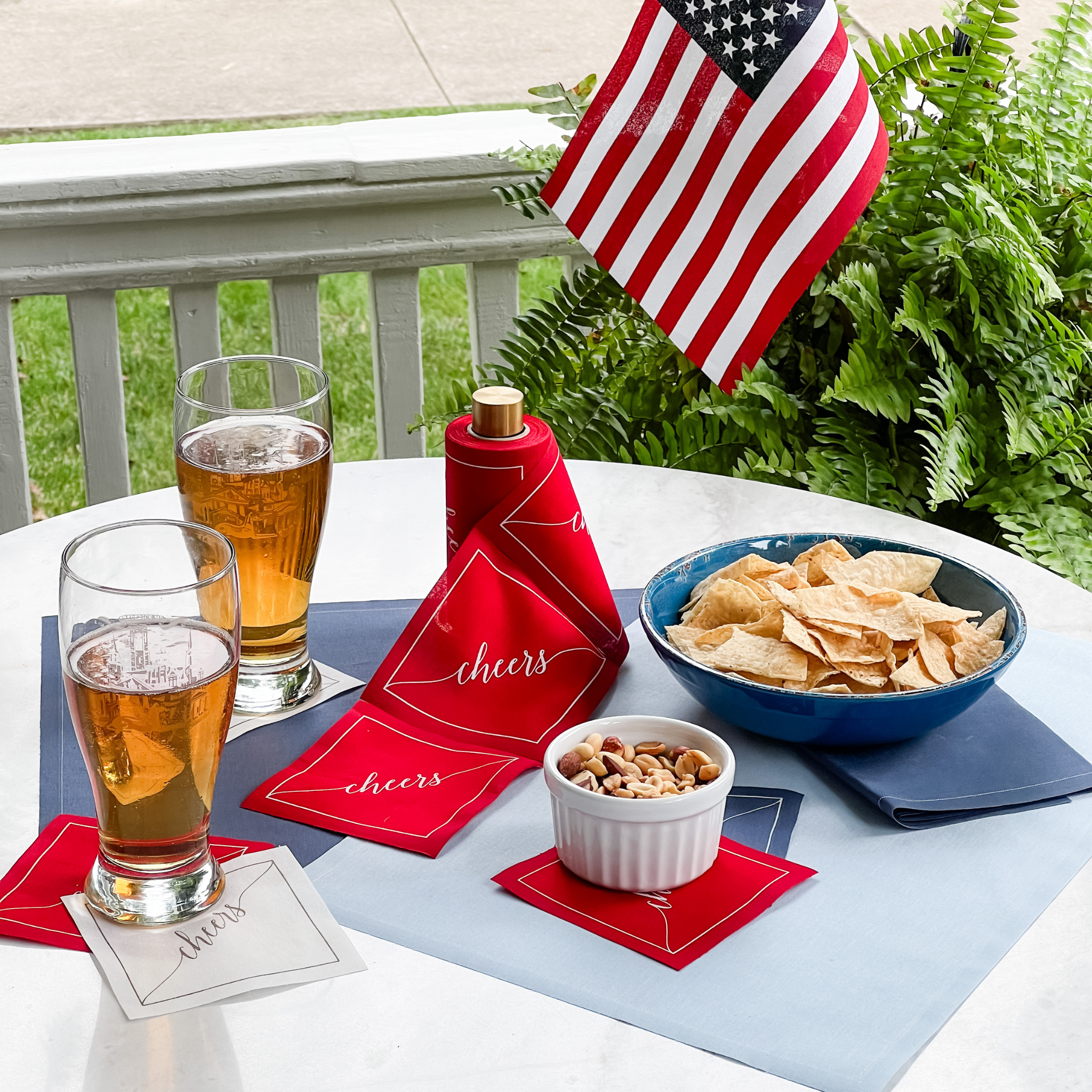 Table Theory (Formerly Toasting with Tara) - Wholesale Disposable Napkin - Cotton Cocktail Napkin Roll: The Red Carpet - White "Cheers"5