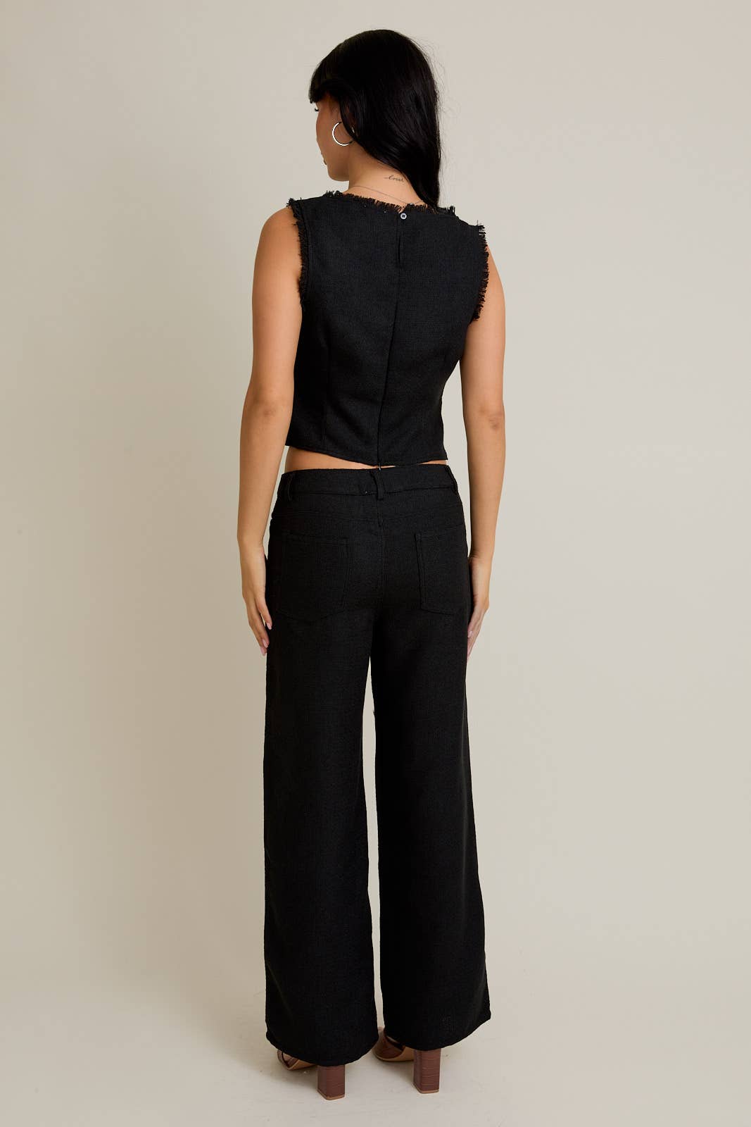 Black SLEEVELESS BOAT NECK FRONT CUT OUT TOP WITH WIDE LEG PANTS for wholesale on Faire2