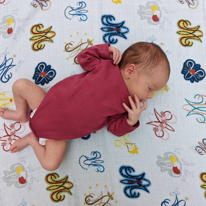 Auspice Maria Swaddle for wholesale by worthy of Agape