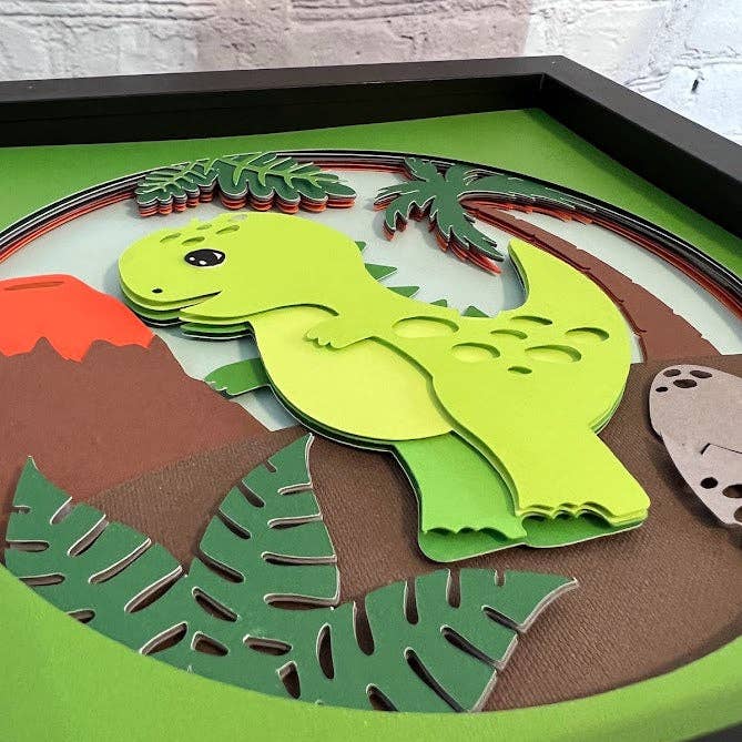 Olivia Reagan Designs - Vendita all'ingrosso Decorazione da parete 3D - Arte cartacea 3D dei cartoni animati T-Rex in una scatola d'ombra