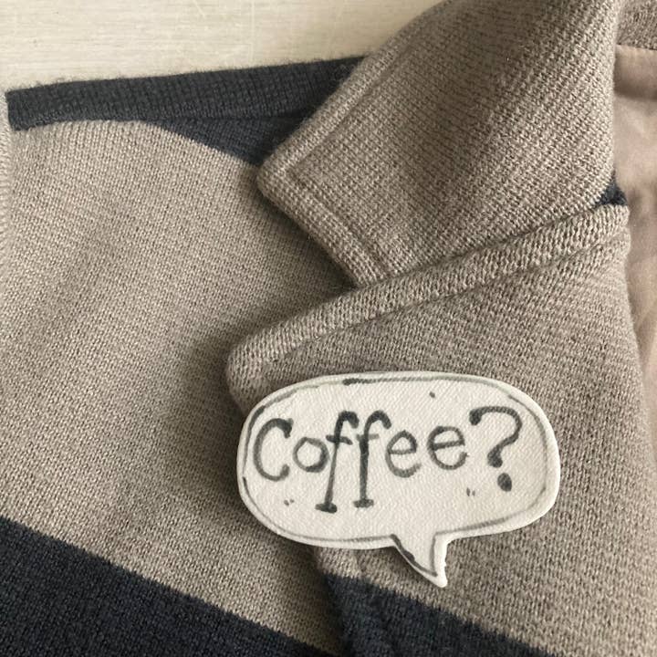 Porcelain badge with hand painted "Coffee?" for wholesale by Quirk&Whimsy