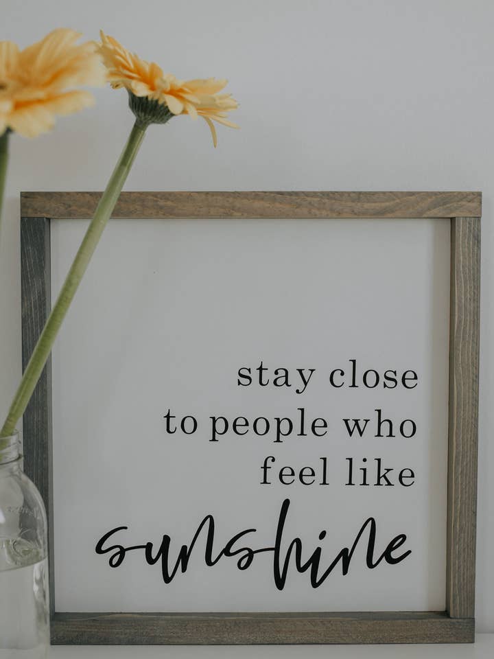 Stay Close to People Who Feel Like Sunshine for wholesale by Wooden Arrow Designs