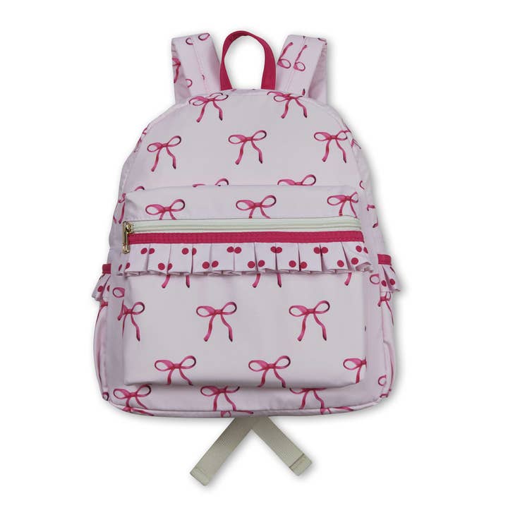 Pink bow polka dots ruffle kids girls backpack for wholesale by Yawoo Garments