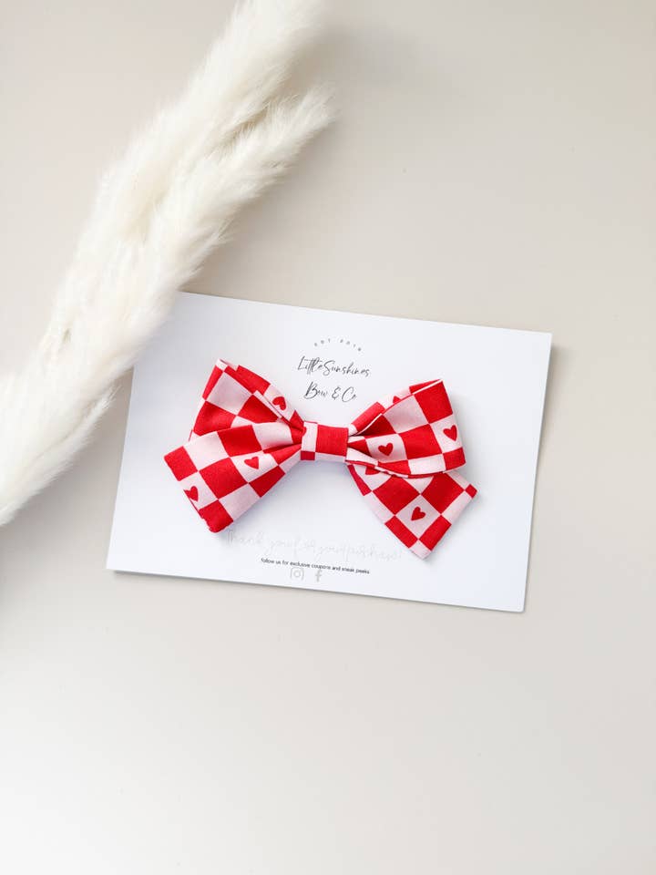 Red Checkered Valentines Day Pinwheel Bow for wholesale by Little Sunshines Bow & Co