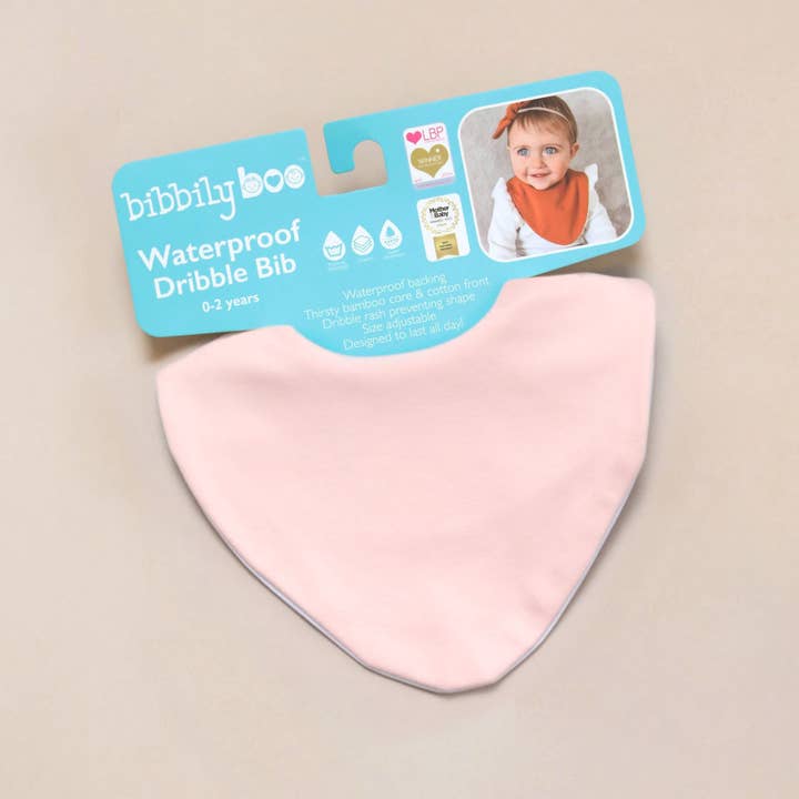 Blush Pink Waterproof Dribble Bib for wholesale by Bibbilyboo
