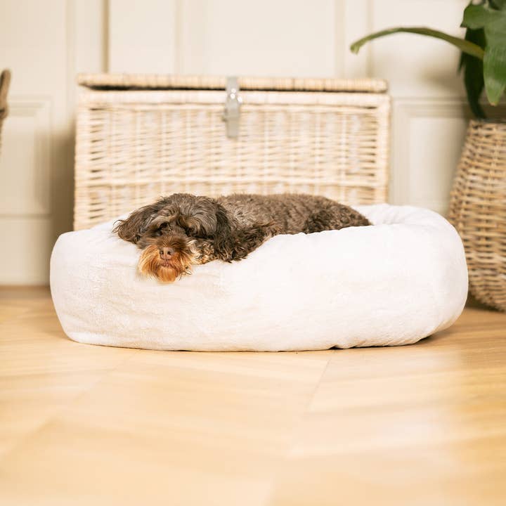 Calming Anti-Anxiety Donut Bed With Removable Covers in Cream Faux Fur by Lords & Labradors for wholesale on Faire2