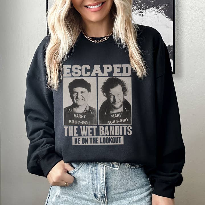 NVC Ecommerce LLC - Wholesale Graphic Sweatshirt - Women's - Retro Home Alone Escaped Mugshots The Wet Bandits Sweatshirt
