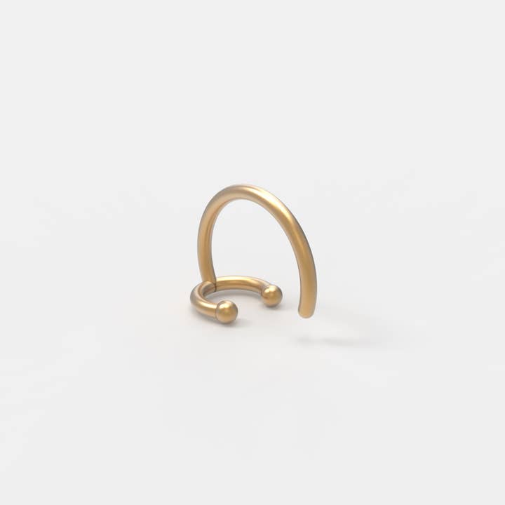GULD Clarks Orbit Nose Pin för wholesale på Faire