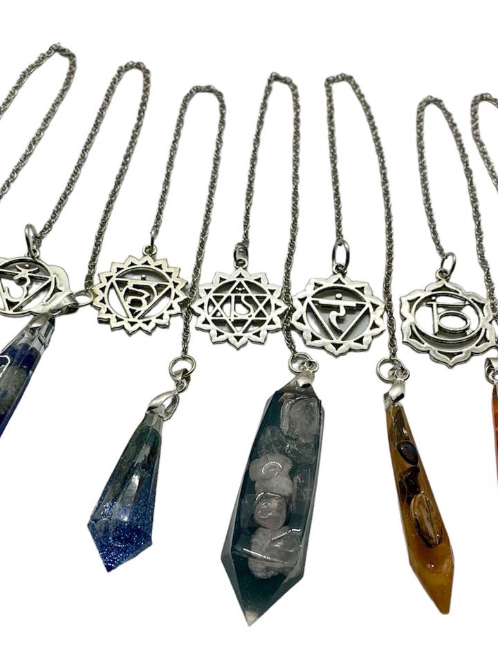 The Group of Seven Chakra Pendulums for wholesale by Orgonics by Driftwood Works Inc