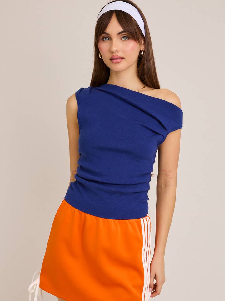 ASYMMETRICAL NECK SWEATER TOP and other Purchase Wholesale elevated basics. Free Returns & Net 60 Terms on Faire trending on Faire.