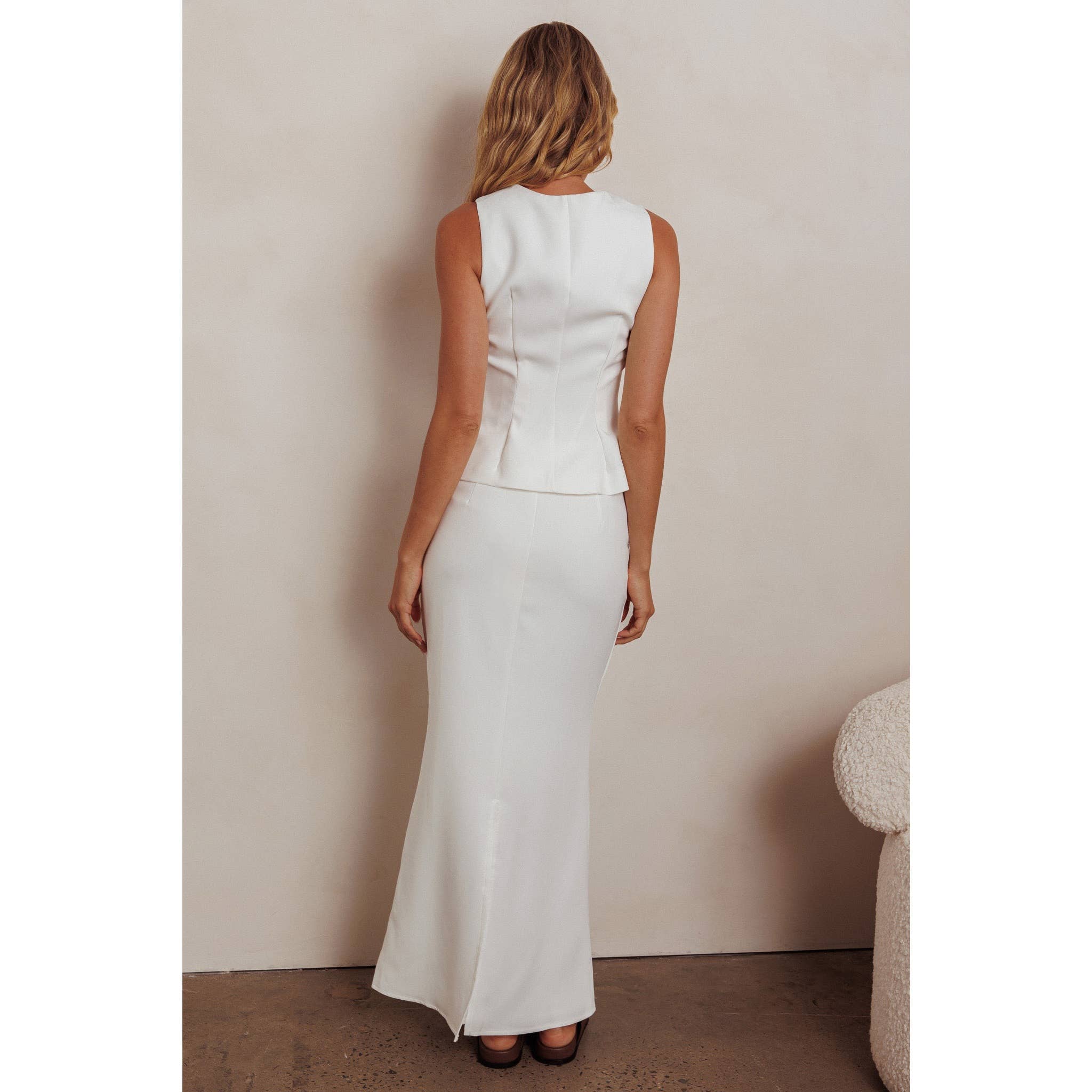 WHITE SLEEVELESS VEST AND SKIRT SET / 64630J for wholesale on Faire1