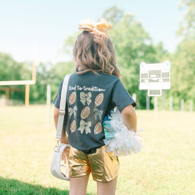Tied to Tradition | Black + Gold | Football Kid’s Tee for wholesale by Magnolia Mudbugs