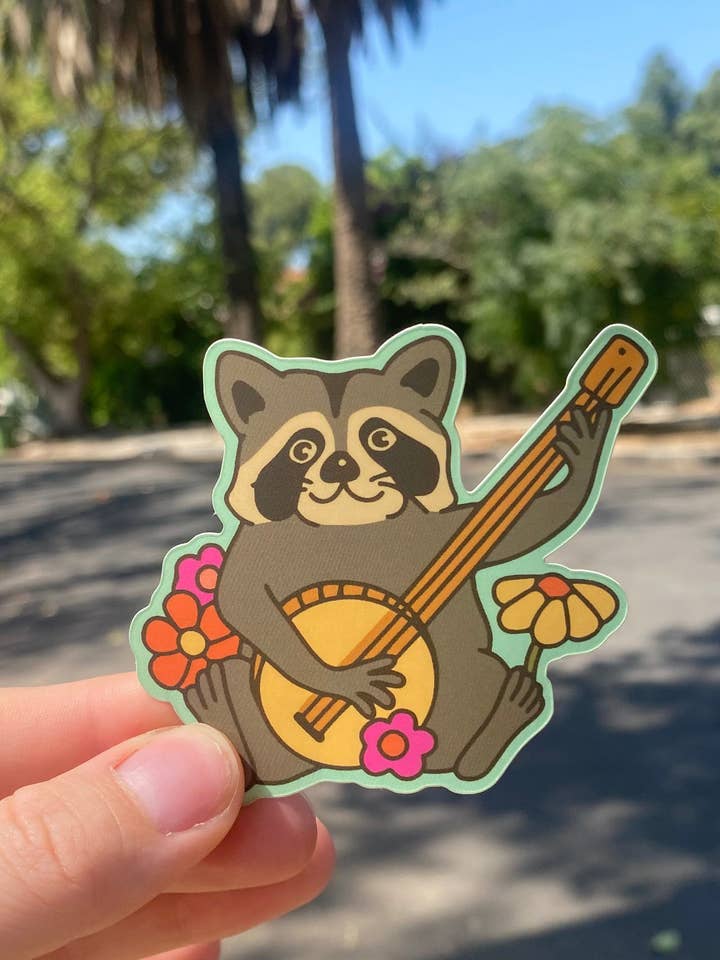 Raccoon Banjo Sticker for wholesale by Kira Cyan