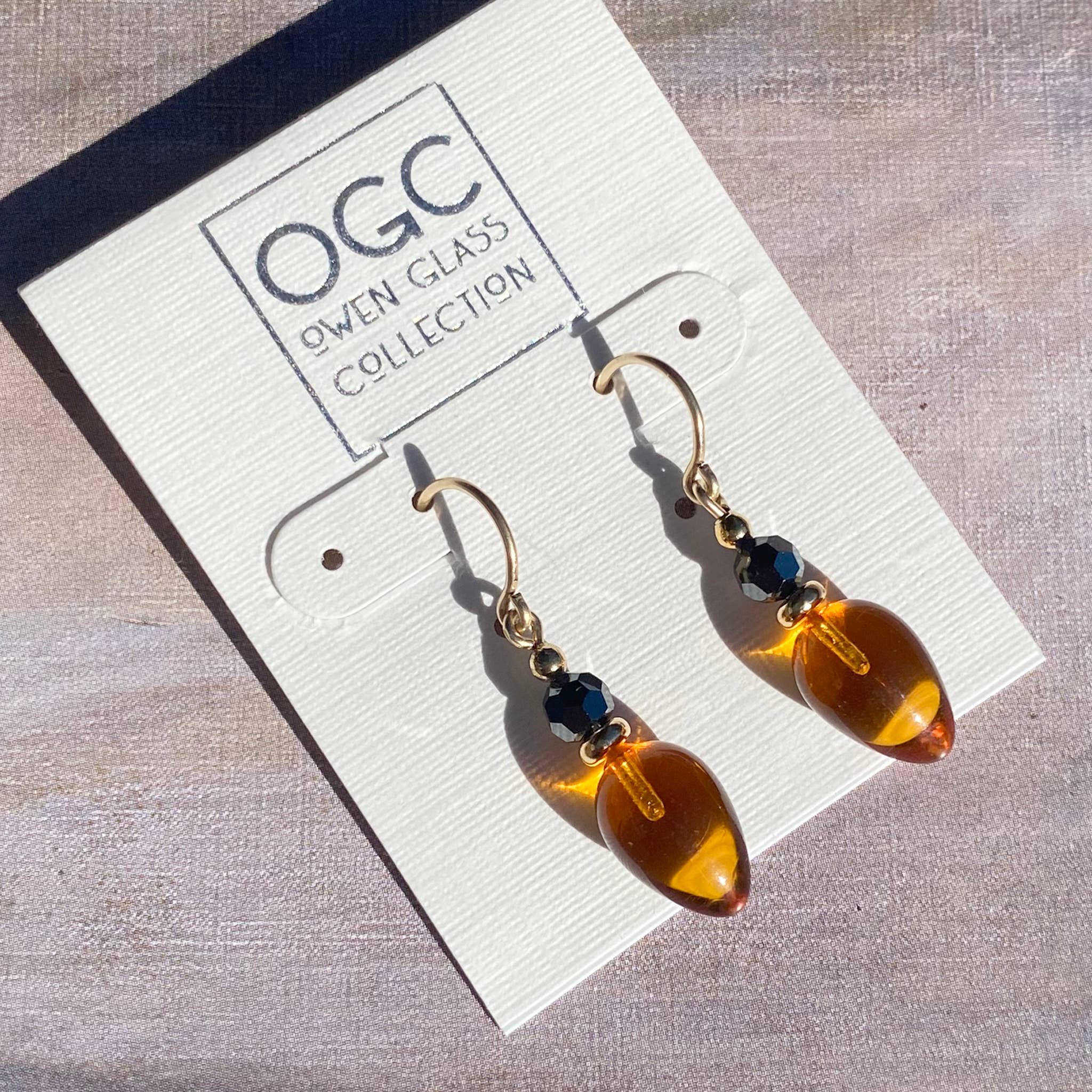Owen Glass Collection - Wholesale Dangle Earrings - PLUMS 67 - TOPAZ GLASS AND HEMATITE EARRINGS, GOLD TRIM 3