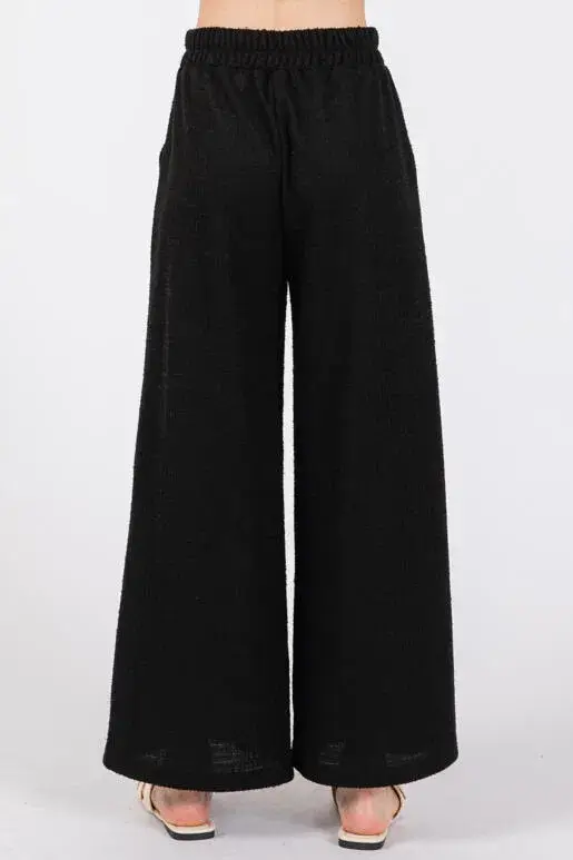 Preto Calças de Tweed de Perna Larga para venda a revendedores na Faire6