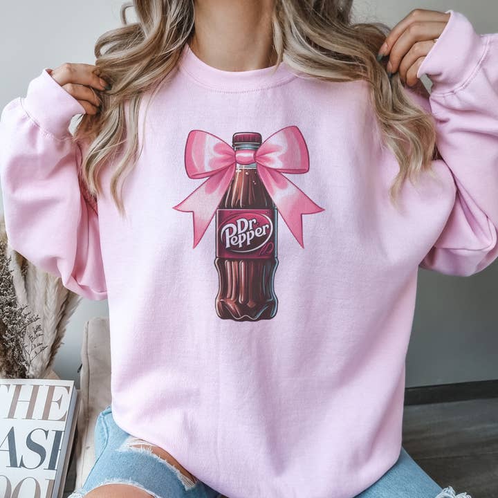 Par.tees by Party On! - Wholesale Graphic Sweatshirt - Women's - Coquette Dr. Pepper Pink Bow Soda Bottle Graphic Sweatshirt