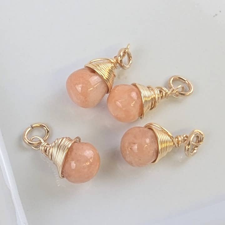 Friendship Peach Calcite Charms in Gold - Pack of 4 for wholesale by Forai