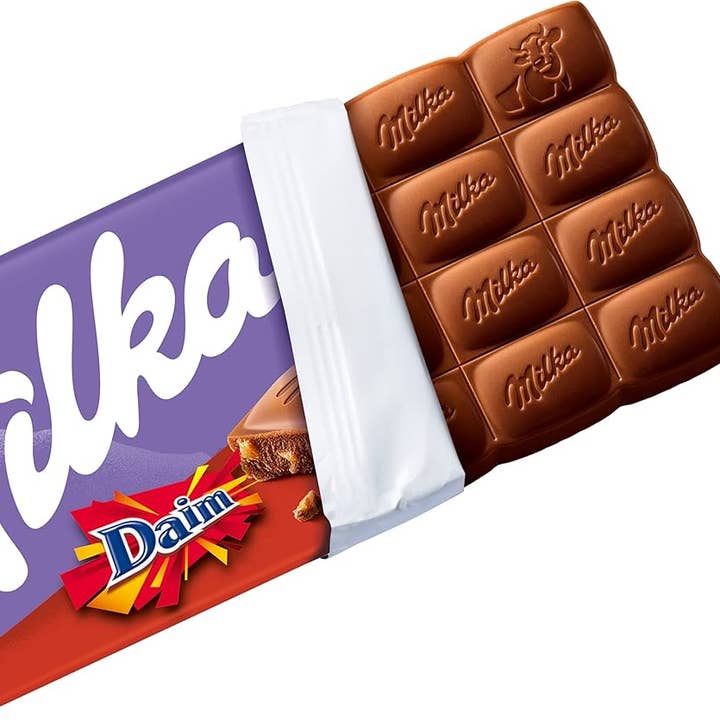 Phoenix Distributions - Venta al por mayor Chocolate - MILKA - Daim 100 gramos, 22 unidades