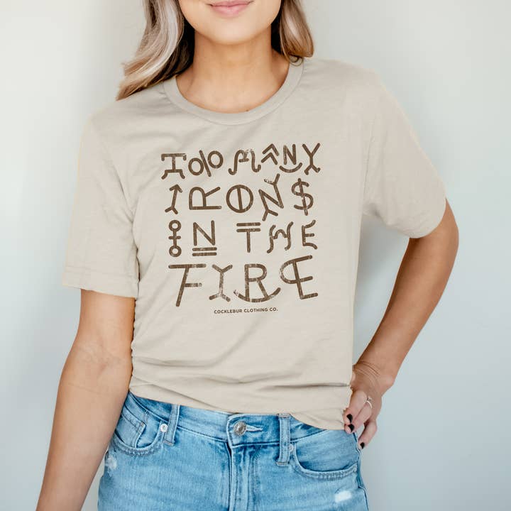 Too Many Irons Graphic Tee and other Purchase Wholesale will of the many. Free Returns & Net 60 Terms on Faire trending on Faire.